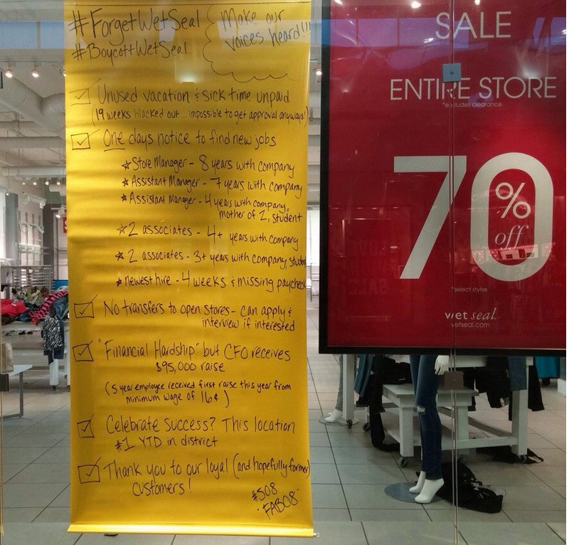 Illustration for article titled Wet Seal Employees Say Fuck Wet Seal With Giant Sign On Store